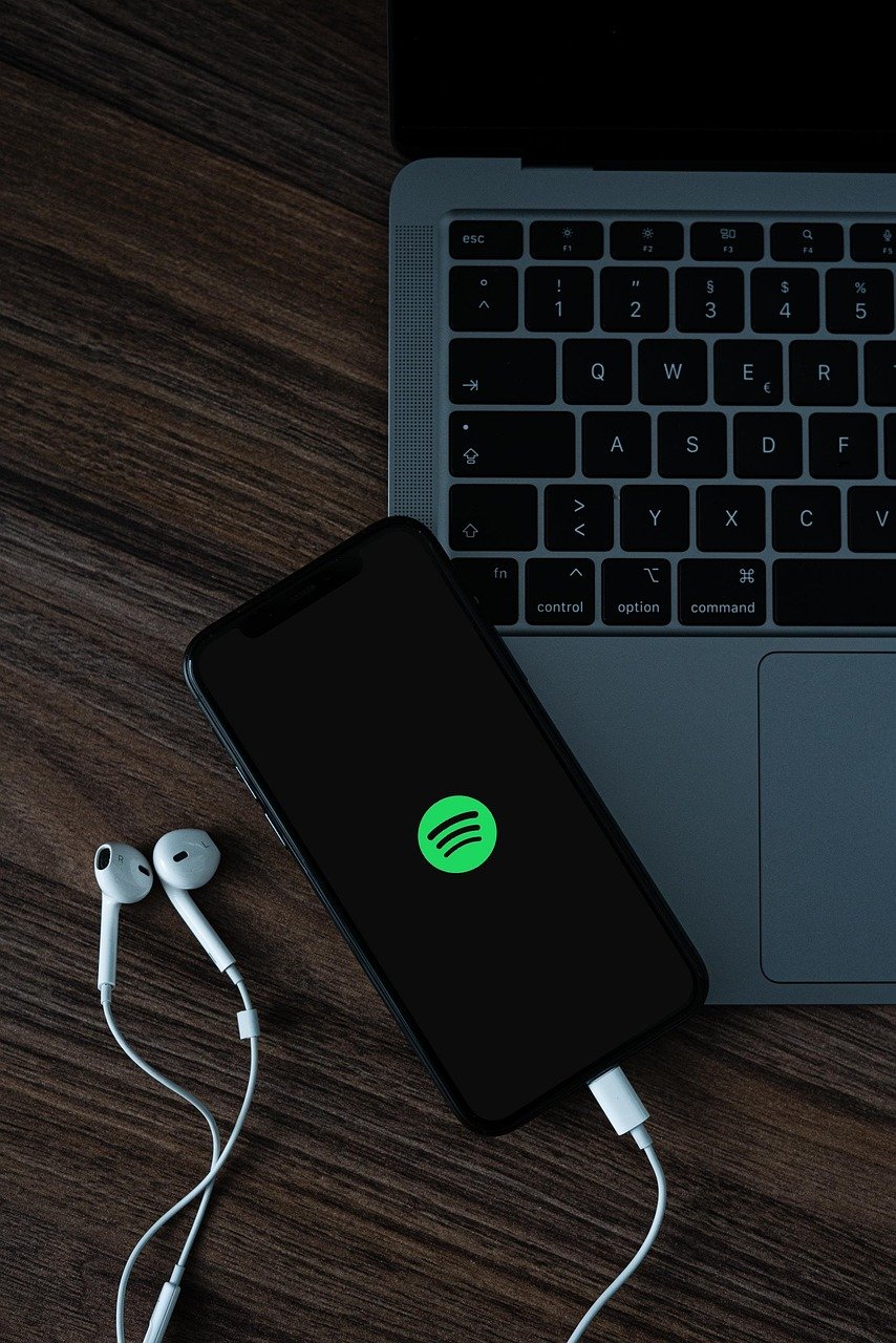 mobile phone, headphones, spotify, smartphone, cellphone, music service, music, social media, entertainment, podcast, laptop, macbook, technology, spotify, spotify, spotify, spotify, spotify